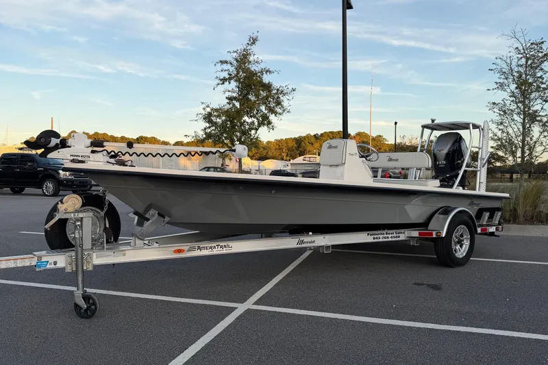 Slide: The Image of 2022 Maverick 18 HPX-V boat on trailer in parking lot, side view. - 1