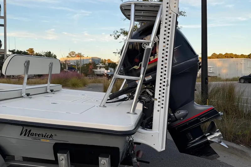 Slide: The Image of 2022 Maverick 18 HPX-V boat with Yamaha outboard motor, parked outdoors. - 11