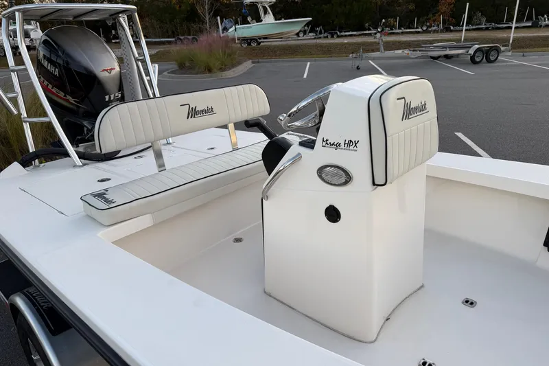 Slide: The Image of 2022 Maverick 18 HPX-V boat interior with Yamaha 115 engine in parking lot. - 14