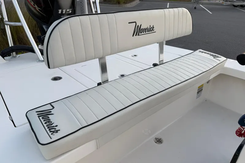 Slide: The Image of 2022 Maverick 18 HPX-V boat with white cushioned seating and Yamaha 115 engine. - 15