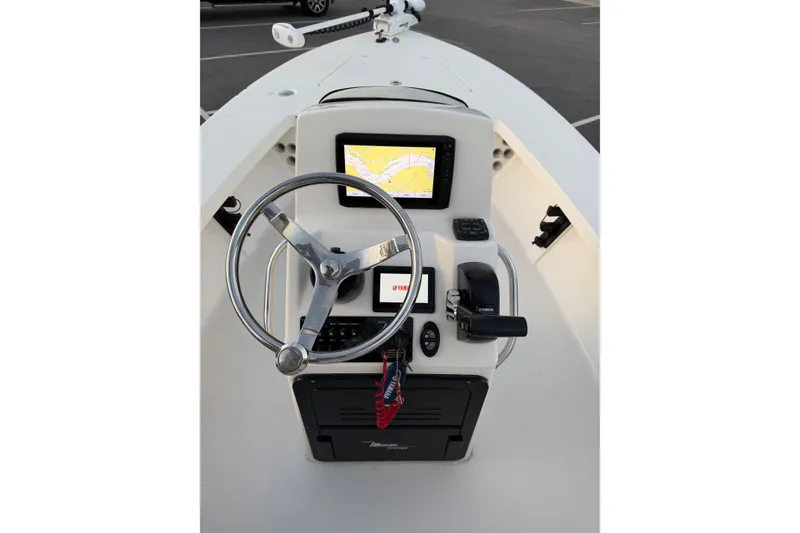 Slide: The Image of 2022 Maverick 18 HPX-V boat console with steering wheel and navigation display. - 16