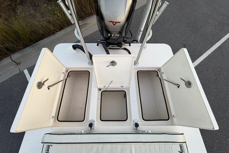Slide: The Image of 2022 Maverick 18 HPX-V boat with open storage compartments and Yamaha engine. - 24