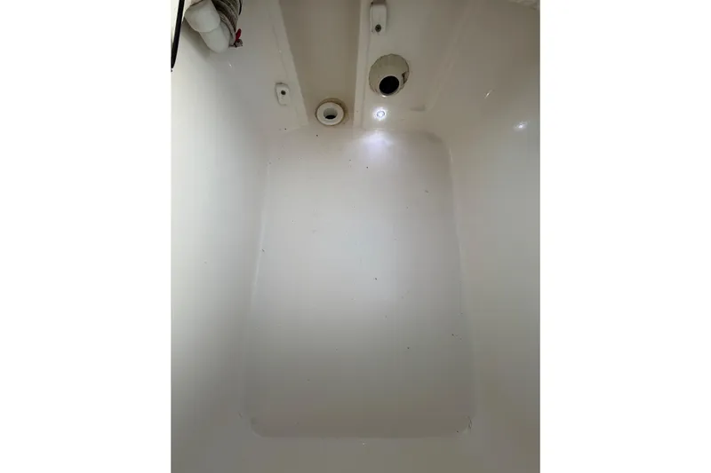 Slide: The Image of 2022 Maverick 18 HPX-V boat interior, showing clean, white compartment space. - 25