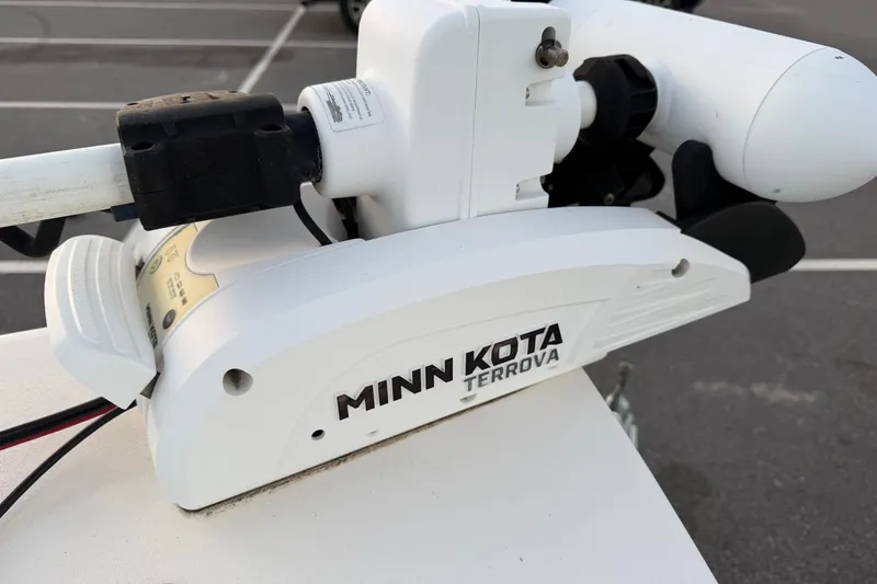 Slide: The Image of Minn Kota Terrova motor on 2022 Maverick 18 HPX-V boat in parking lot. - 29