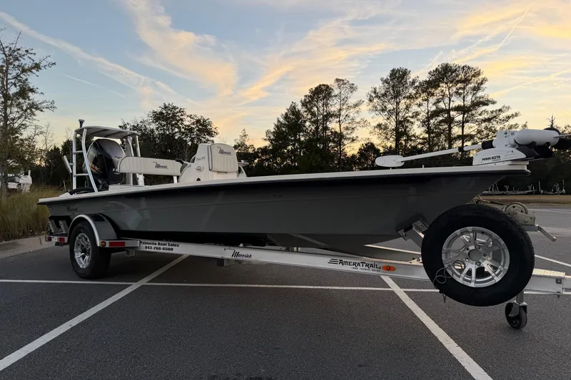Slide: The Image of 2022 Maverick 18 HPX-V boat on trailer in parking lot at sunset. - 4