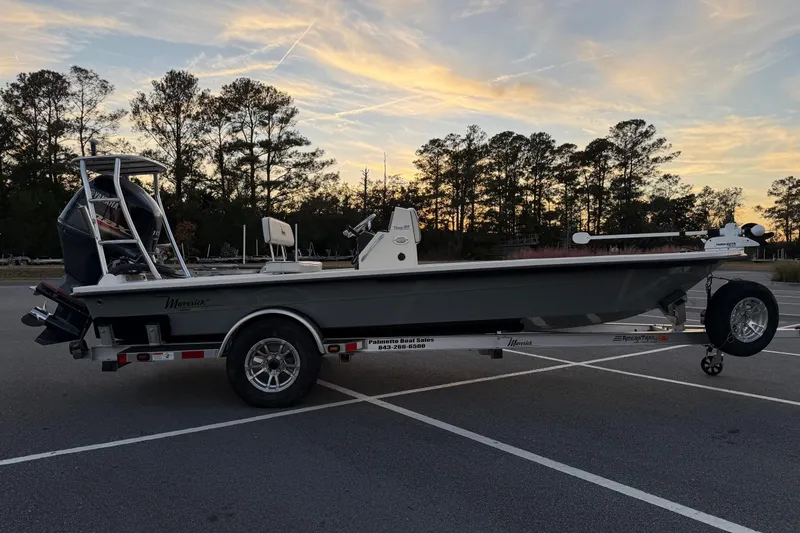 Slide: The Image of 2022 Maverick 18 HPX-V boat on trailer at sunset in parking lot. - 5