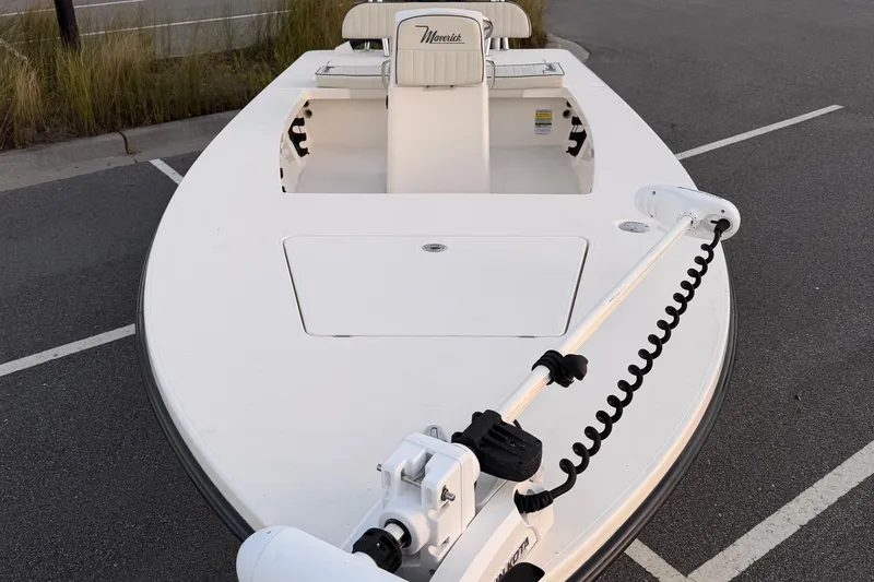 Slide: The Image of 2022 Maverick 18 HPX-V boat with trolling motor, parked on asphalt. - 7