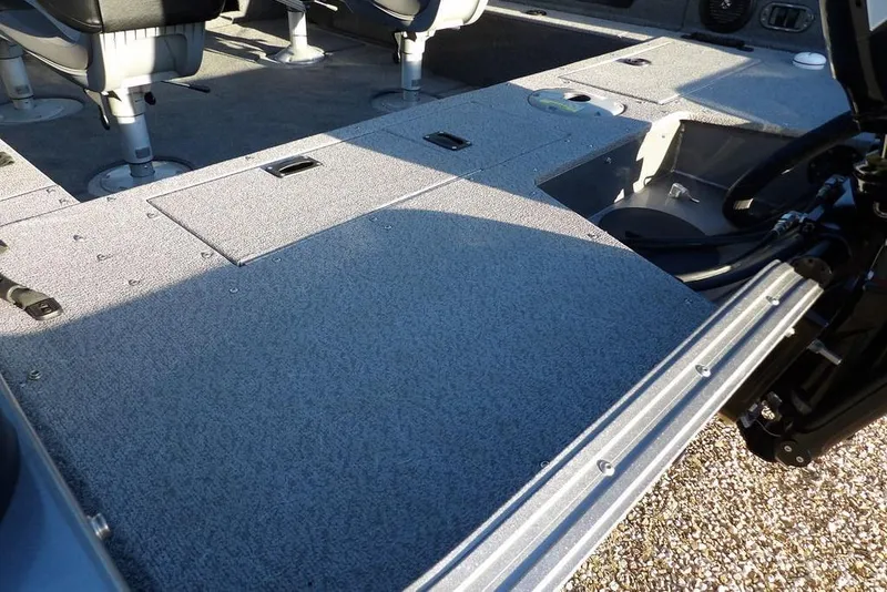 Slide: The Image of 2018 Crestliner 1950 Fish Hawk WT interior with seating and storage compartments. - 13