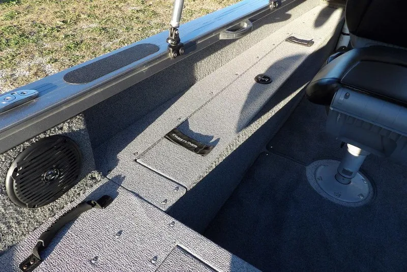 Slide: The Image of 2018 Crestliner 1950 Fish Hawk WT interior with seating and storage compartments. - 17