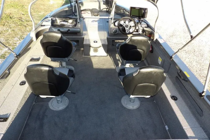 Slide: The Image of 2018 Crestliner 1950 Fish Hawk WT interior with four seats and steering console. - 22
