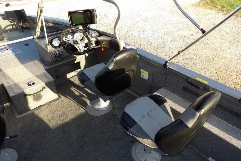 Slide: The Image of 2018 Crestliner 1950 Fish Hawk WT interior with steering console and seating. - 23