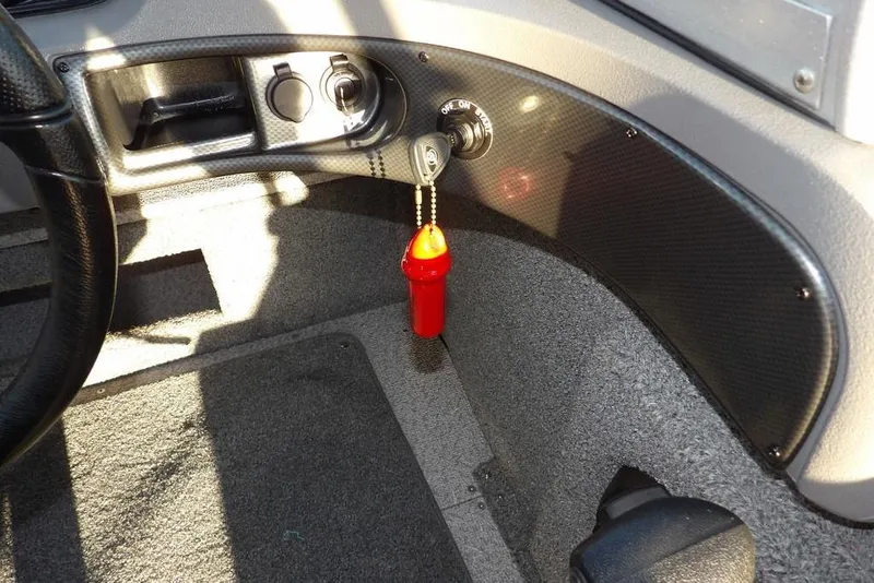 Slide: The Image of Interior of 2018 Crestliner 1950 Fish Hawk WT boat with ignition and red safety key. - 29