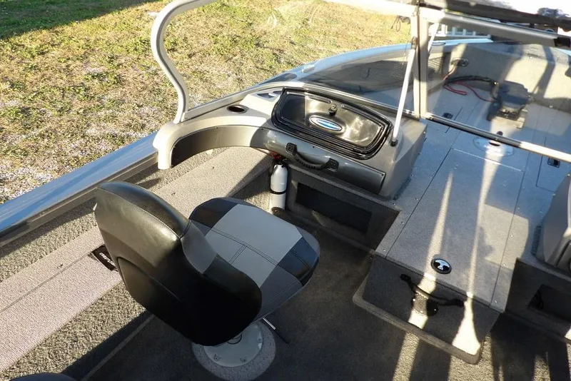 Slide: The Image of 2018 Crestliner 1950 Fish Hawk WT interior with seating and storage compartments. - 32