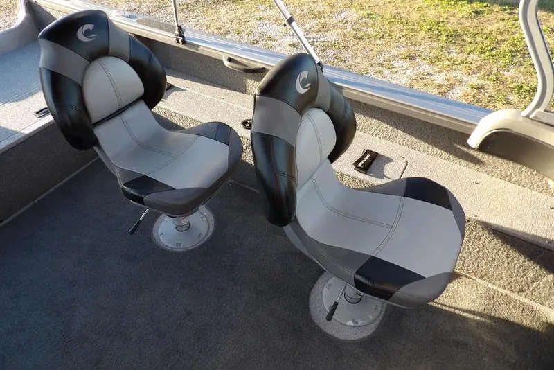 Slide: The Image of Two cushioned seats in a 2018 Crestliner 1950 Fish Hawk WT boat interior. - 33