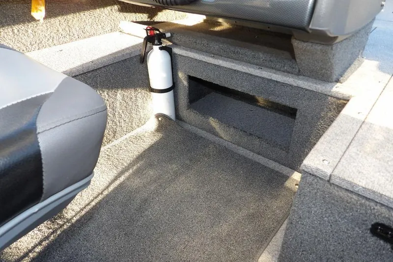 Slide: The Image of 2018 Crestliner 1950 Fish Hawk WT interior with fire extinguisher and carpeted flooring. - 37