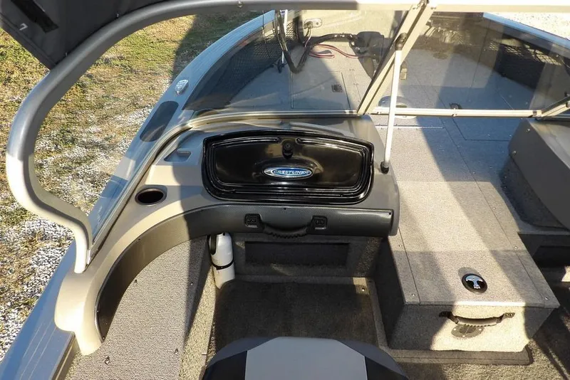 Slide: The Image of 2018 Crestliner 1950 Fish Hawk WT boat interior with storage compartments and seating. - 42