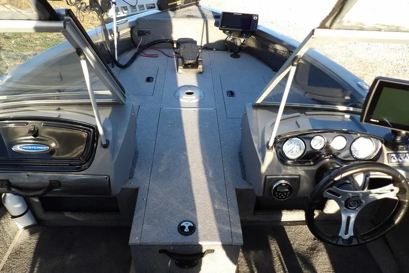 Slide: The Image of 2018 Crestliner 1950 Fish Hawk WT boat interior with dual consoles and modern dashboard. - 44