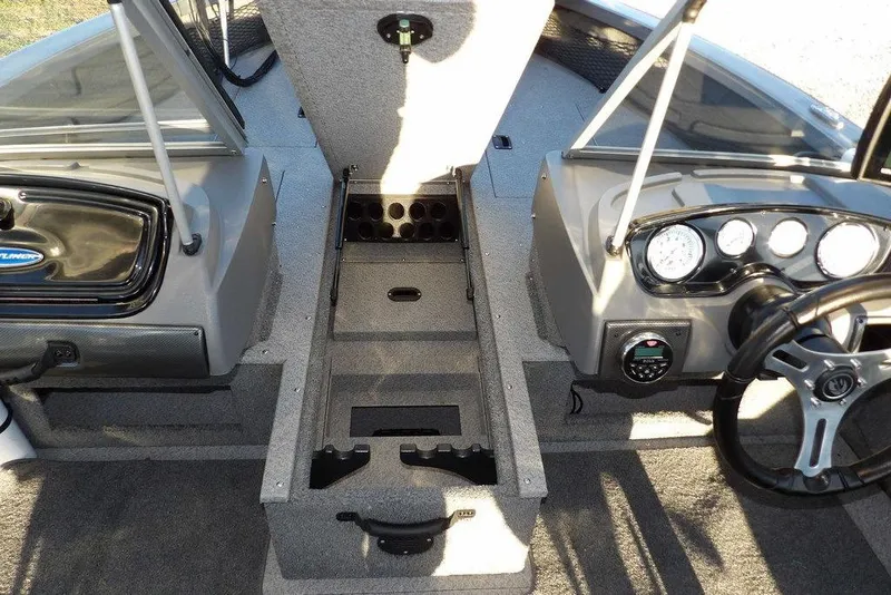 Slide: The Image of 2018 Crestliner 1950 Fish Hawk WT boat interior with open storage compartment and dashboard. - 47