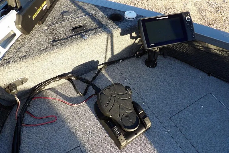 Slide: The Image of 2018 Crestliner 1950 Fish Hawk WT boat interior with fish finder and foot pedal. - 50