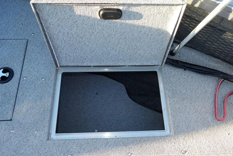 Slide: The Image of Open storage compartment on 2018 Crestliner 1950 Fish Hawk WT boat deck. - 53