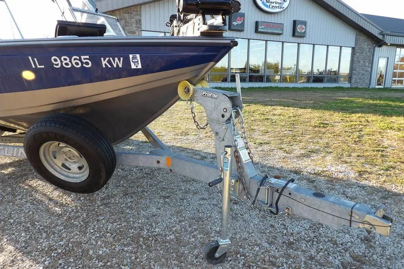 Slide: The Image of 2018 Crestliner 1950 Fish Hawk WT boat on trailer outside marine center. - 56