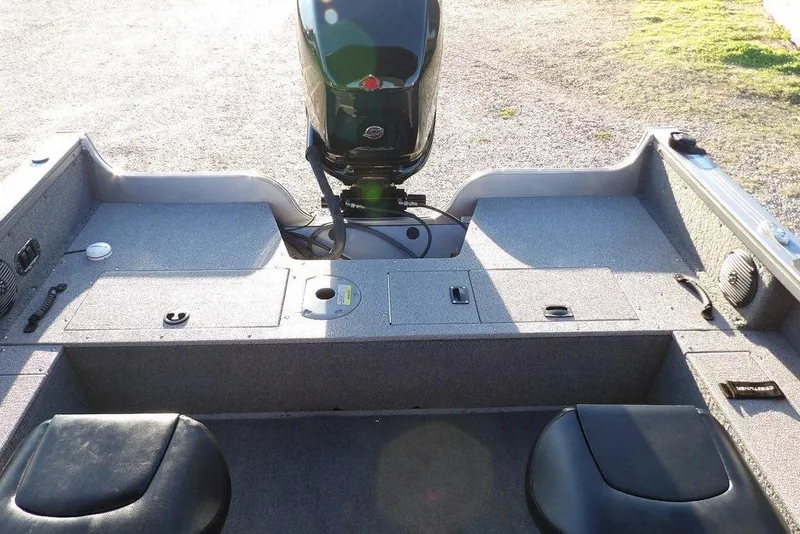 Slide: The Image of 2018 Crestliner 1950 Fish Hawk WT boat interior with motor and seating. - 8