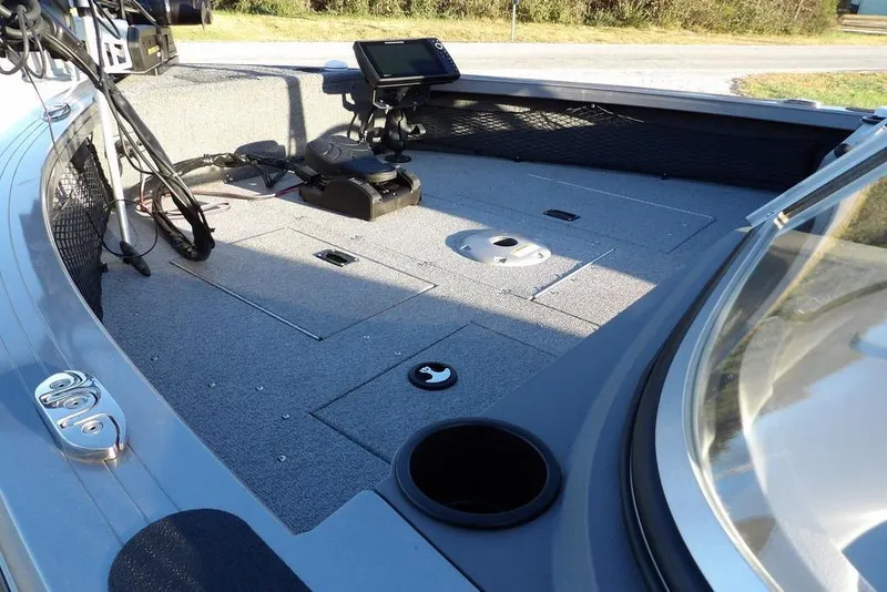 Slide: The Image of 2018 Crestliner 1950 Fish Hawk WT boat interior with fishing equipment and storage compartments. - 9