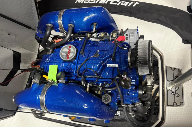 Slide: The Image of 2025 MasterCraft ProStar engine with blue Ilmor components, detailed view. - 6