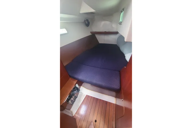 Slide: The Image of Bathroom interior of 2005 Beneteau Oceanis 393 yacht, featuring toilet and shower. - 15