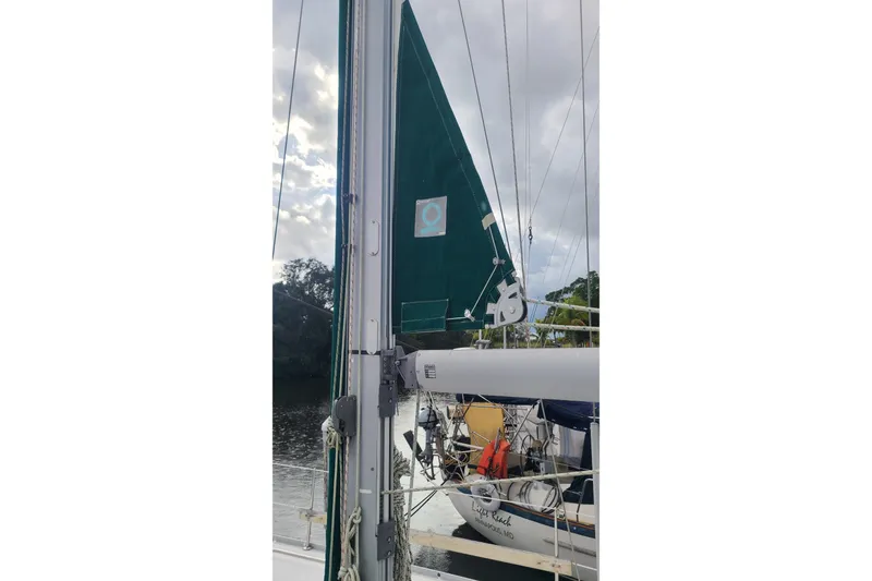 Slide: The Image of Interior of 2005 Beneteau Oceanis 393 yacht with cozy seating and wooden table. - 18