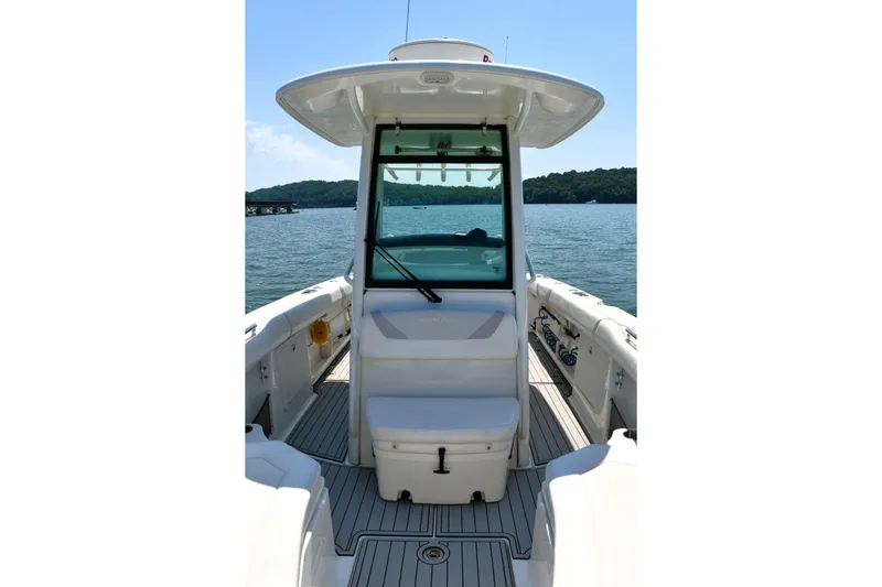 Slide: The Image of 2016 Boston Whaler 280 Outrage boat interior with helm, on a sunny day. - 12
