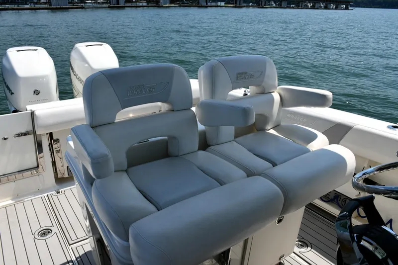 Slide: The Image of 2016 Boston Whaler 280 Outrage boat interior with luxurious seating and dual engines. - 13