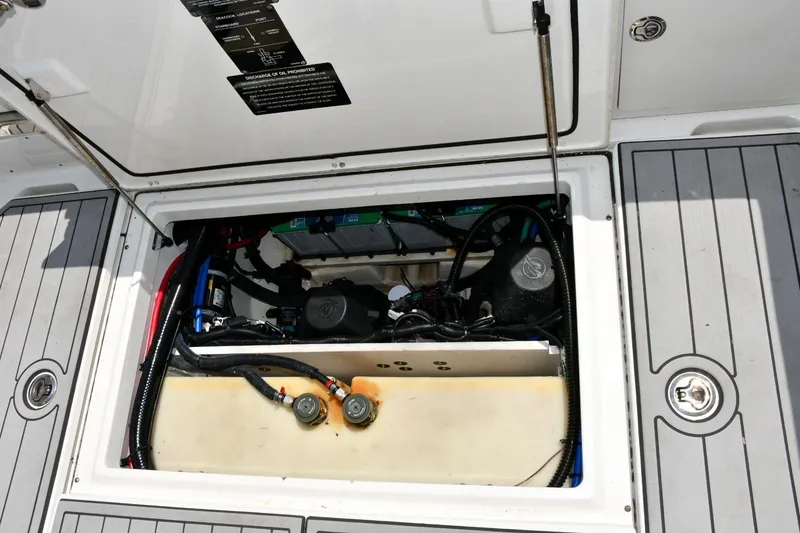 Slide: The Image of 2016 Boston Whaler 280 Outrage engine compartment with visible wiring and components. - 25