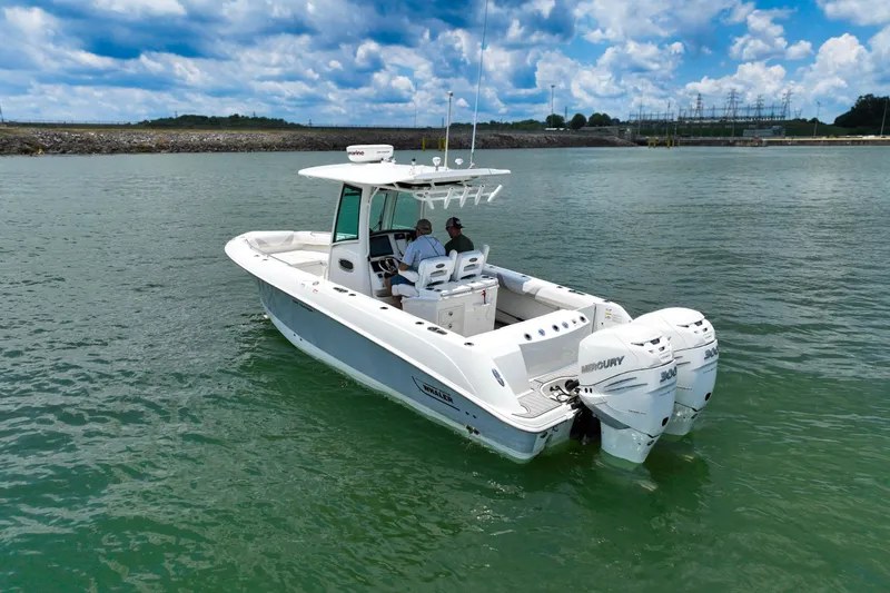 Slide: The Image of 2016 Boston Whaler 280 Outrage boat on water, featuring twin Mercury engines. - 4