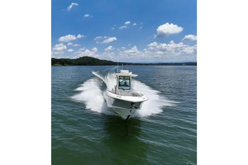 Slide: The Image of 2016 Boston Whaler 280 Outrage cruising on a lake under a clear blue sky. - 5