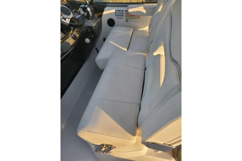 Slide: The Image of 2015 Monterey 315 Sport Yacht interior with plush seating and modern dashboard. - 19