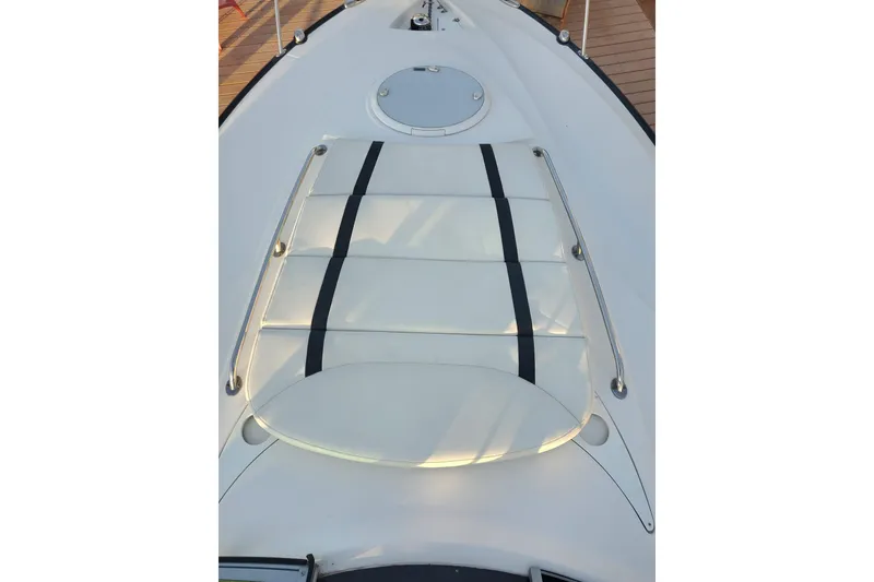 Slide: The Image of 2015 Monterey 315 Sport Yacht deck with sunpad and stainless steel rails. - 20