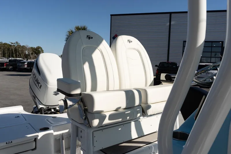 Slide: The Image of 2026 Sea Pro 230 Bay boat with Suzuki engine, featuring white seating and modern design. - 14