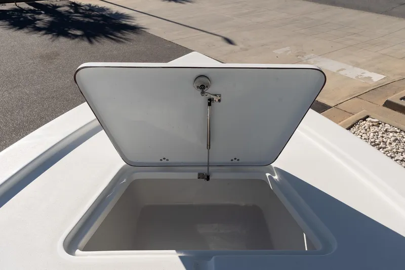 Slide: The Image of Open storage compartment on 2026 Sea Pro 230 Bay boat deck. - 17