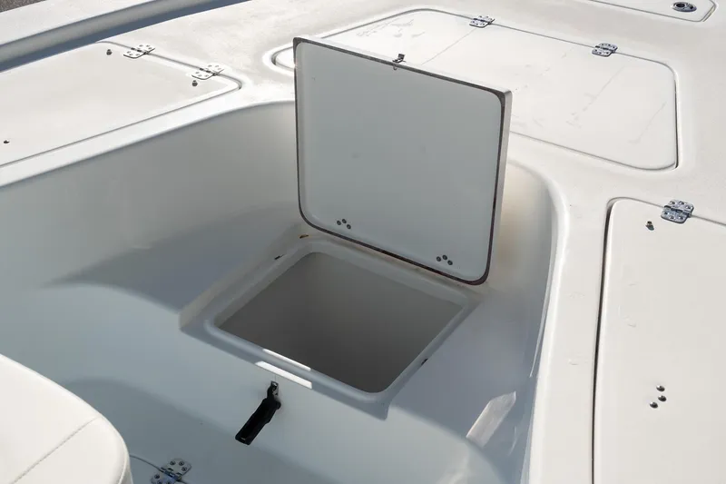 Slide: The Image of 2026 Sea Pro 230 Bay boat storage compartment with open hatch. - 18