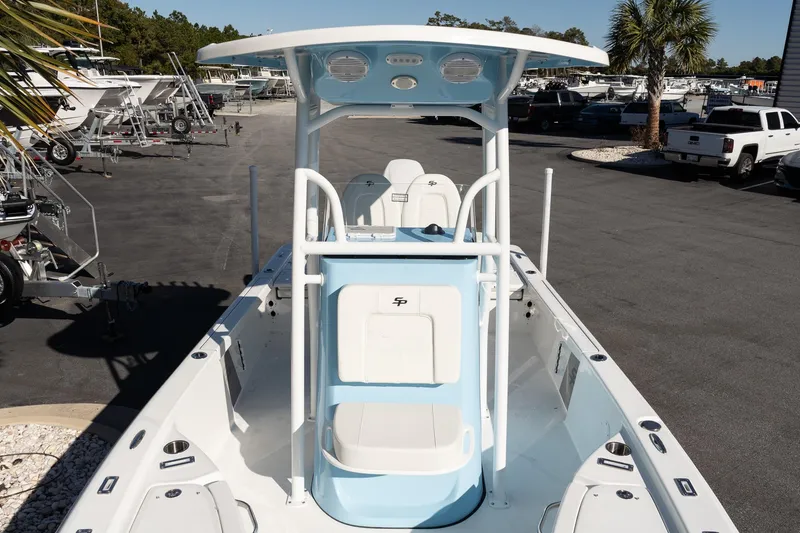 Slide: The Image of 2026 Sea Pro 230 Bay boat with T-top, parked in a marina. - 19