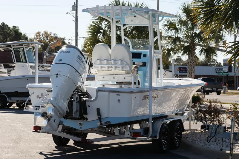 Slide: The Image of 2026 Sea Pro 230 Bay boat on trailer, featuring a powerful Suzuki outboard motor. - 5