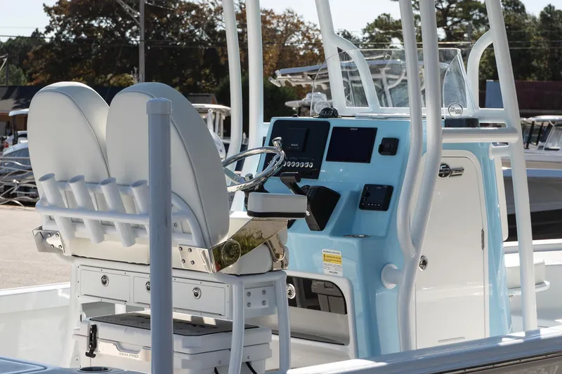 Slide: The Image of 2026 Sea Pro 230 Bay boat interior with dual seats and modern control panel. - 6