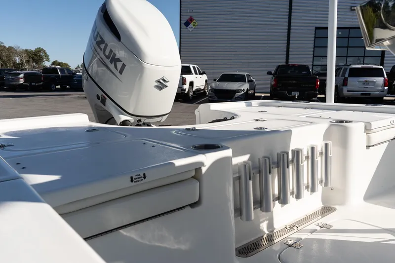 Slide: The Image of 2026 Sea Pro 230 Bay boat with Suzuki outboard motor in a parking lot. - 8