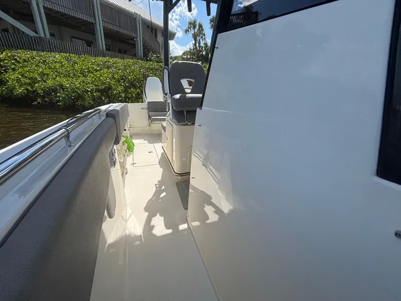 Slide: The Image of 2023 Stingray 273 CC boat interior with seating and sleek design. - 14