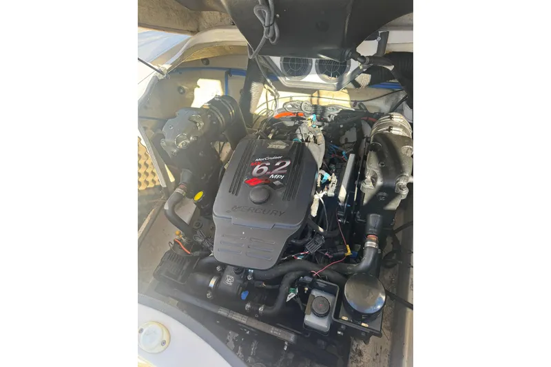 Slide: The Image of 2008 Sea Ray 260 Sundeck engine compartment with MerCruiser 6.2 MPI engine. - 15