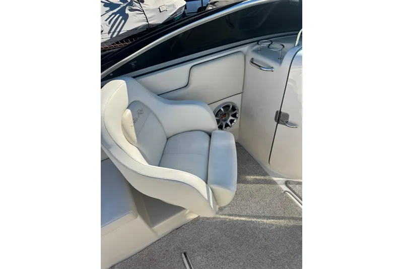 Slide: The Image of 2008 Sea Ray 260 Sundeck interior with plush seating and speaker detail. - 8