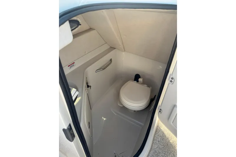 Slide: The Image of 2008 Sea Ray 260 Sundeck boat interior bathroom with compact toilet. - 9