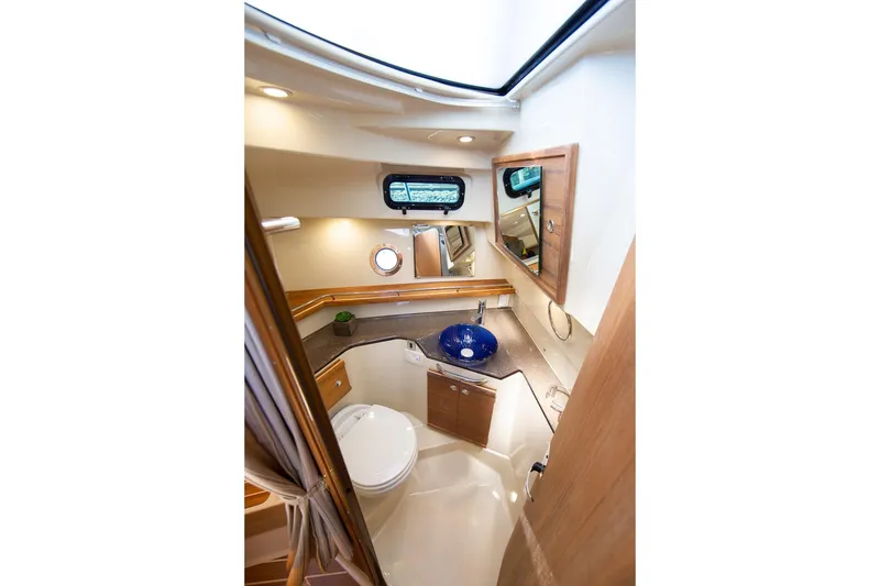 Slide: The Image of Luxurious bathroom interior of 2026 Ranger Tugs R-29CB with modern fixtures and elegant design. - 11