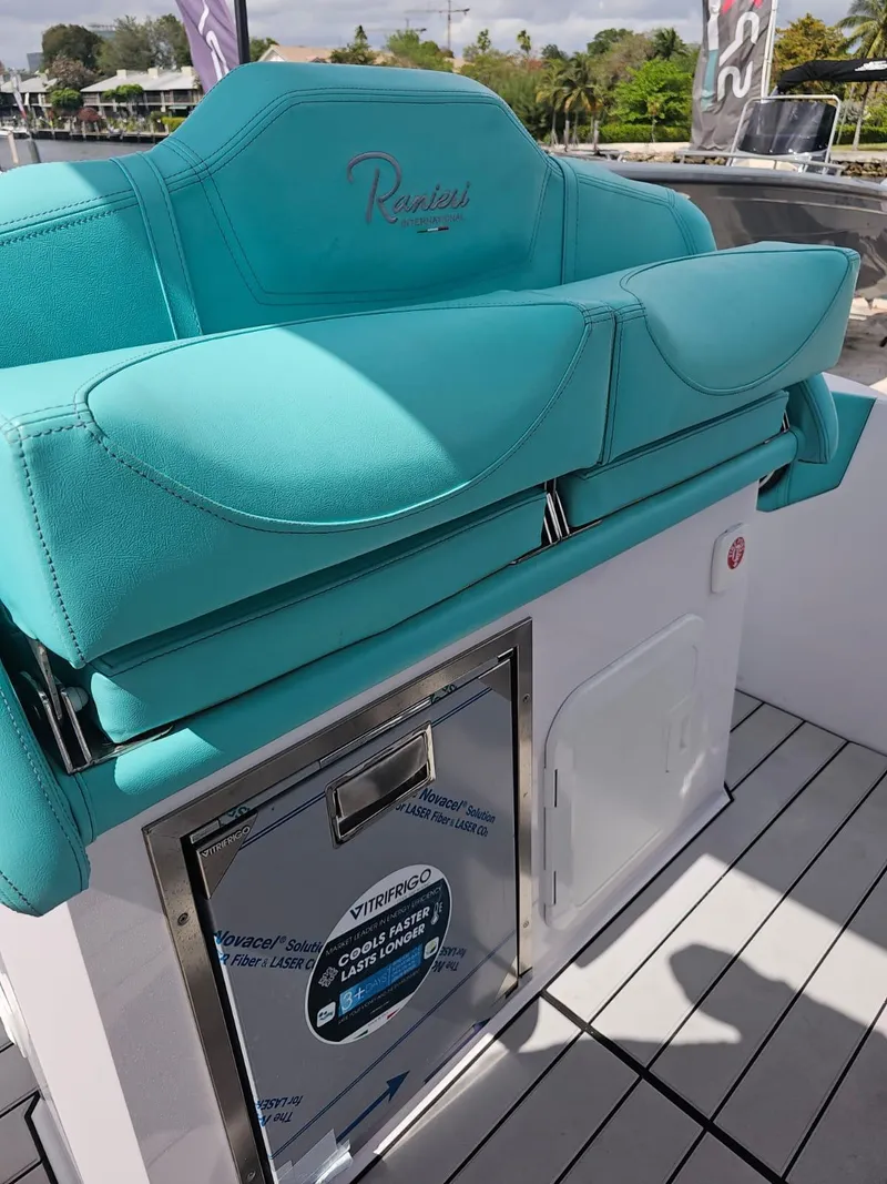 Slide: The Image of 2025 Ranieri CAYMAN 27.0 SPORT TOURING boat seat and storage compartment. - 18